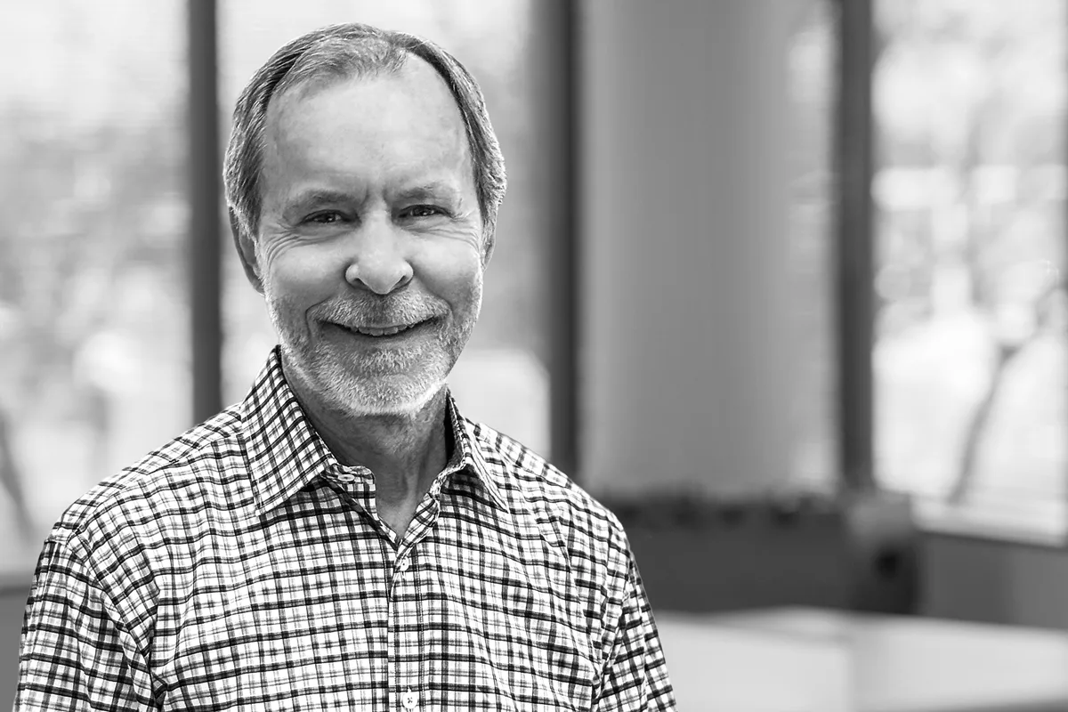 A black and white image of Mike Lewer